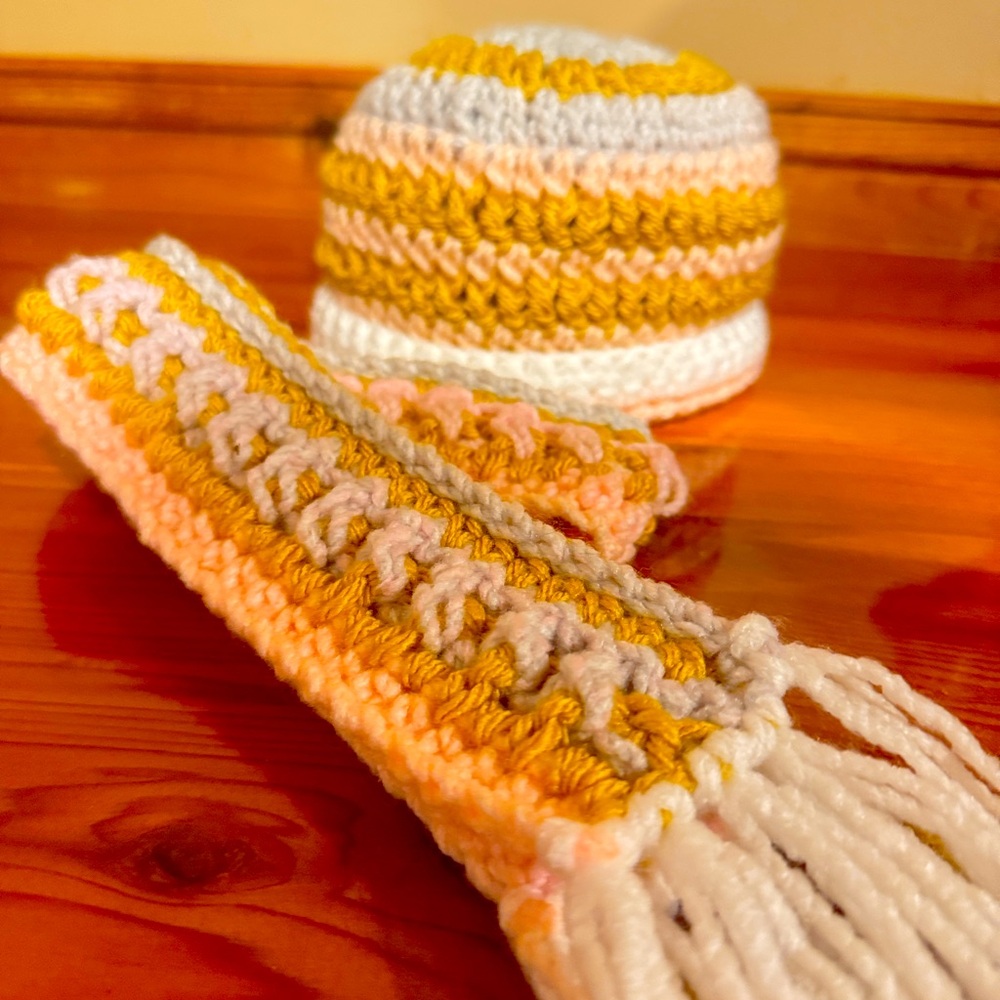 Handmade crochet infant beanie and scarf.